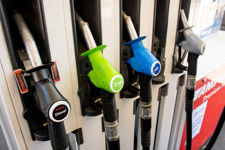 Sydney, Australia 2022-10-29 Petrol pumps hoses on Ampol petrol station. Fuel nozzles oil dispensers. Petrol diesel fuel prices .のeditorial素材
