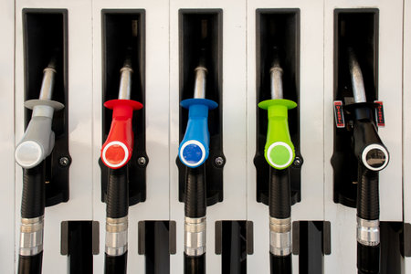 Various gasoline petrol diesel pumps on a gas station. fuel nozzles oil dispensers. fuel price conceptの写真素材