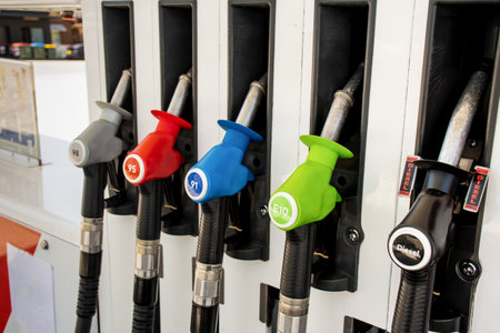 Petrol pumps hoses on a petrol station in Australia - 98, 95, E10, 91, diesel. fuel nozzles oil dispensers. Petrol diesel fuel prices conceptの写真素材