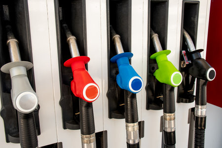 Various gasoline petrol diesel pumps on a gas station. fuel nozzles oil dispensers. fuel price conceptの写真素材