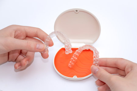 Transparent aligners retainers in a storage case. invisible braces. Clear teeth straighteners. plastic bracersの写真素材