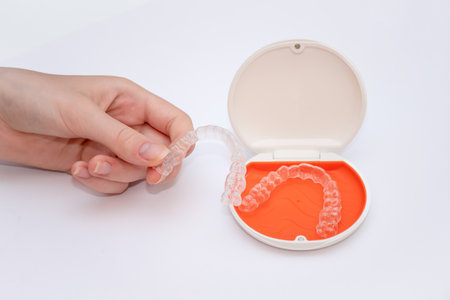 Transparent aligners retainers in a storage case. invisible braces. Clear teeth straighteners. plastic bracersの写真素材