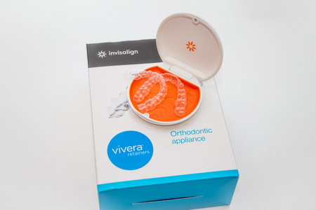 Sydney, Australia, 2022-10-19 Invisalign Vivera retainers in a box. Ortodontic clear retainers used to protect the results of Invisalign bracers treatment.のeditorial素材