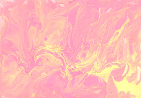 Abstract colorful background. Acrylic fluid art. Yellow, pink, orange and white colors mixed togetherの写真素材