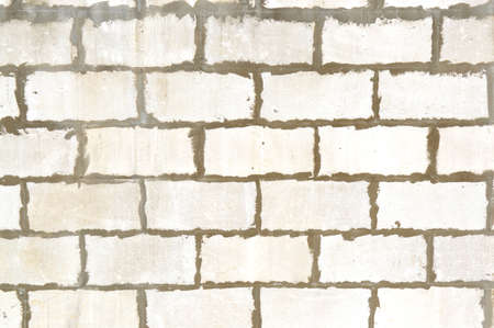 Old brick wall. Ancient stone texture background. Urban background, white ruined industrial brick wall with copy space. Home and office design backdrop. vintage effectの写真素材