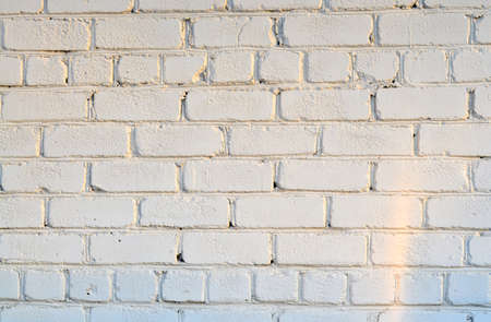 Old white brick wall. Ancient stone texture background. Urban background, white ruined industrial brick wall with copy space. Home and office design backdrop. vintage effectの写真素材