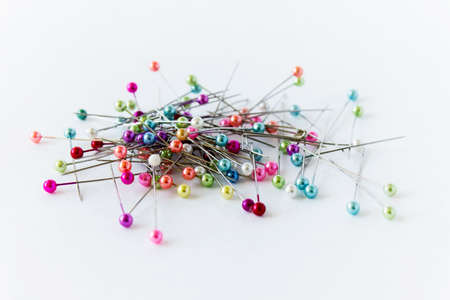 Pile of sewing needles on white background arranged randomly.の写真素材