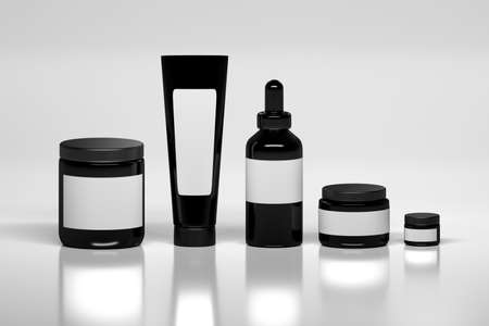 Mockup of a set of skin care products packages. Black plastic shiny cosmetics containers with white blank labels on white background.の写真素材