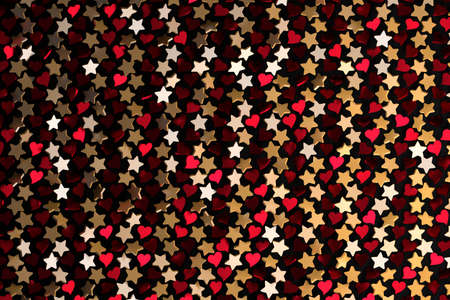 Repeating golden stars and red hearts on black background. Backdrop for Valentine Day or romantic, festive event. 3d illustration.の写真素材