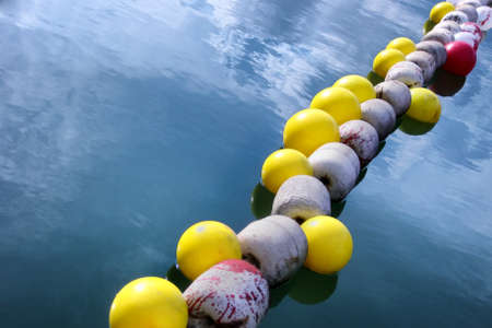 Buoys, navigation mars on the surface of water, water safety marks.の写真素材