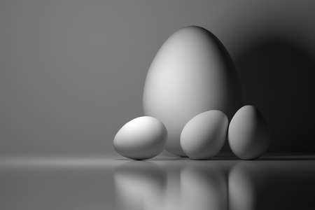 Four Easter eggs. One big and three small white eggs. Image tinted in blue color. Monochrome image....
