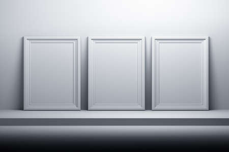 Empty blank white A4 picture photo frames on the shelf with blue tint. 3d illustration.