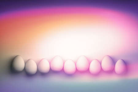 Illustration with small eggs arranged in a row. Image color with magenta pink orange color gradient. 3d illustration.の写真素材