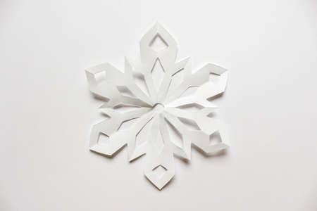 Large white Christmas snowflake on white backgound.の写真素材