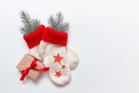 Christmas decoration - handmade socks with evergreen fir red stars and a present tied with red bow...