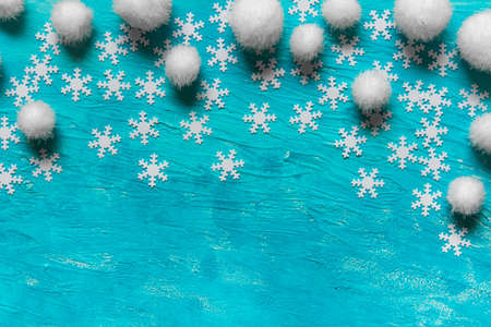 Christmas New Year texture blue background with concept falling snow made of snowflakes and white fluffy balls.の写真素材