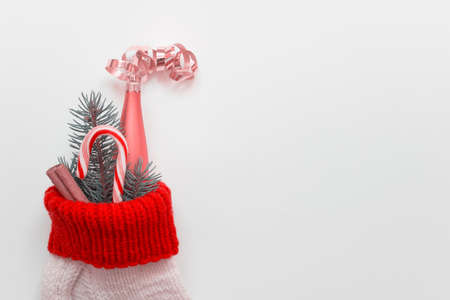 Christmas decor handmade one sock filled with fir branch, cinnamon stick, striped candy cane and...