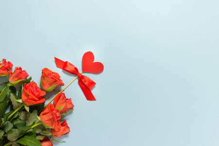 Love Valentine day background with bouquet of roses on blue backgound with copy blank space.の写真素材