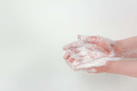Washing hands with plenty of soap foam. Photo with copy blank space.の写真素材