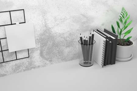 Composition with office work table with black books, spiral notebook, potted plant and white paper sheet. 3d illustration. の写真素材