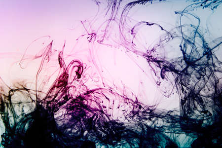 Tinted colored photo of fine structure of dissolving ink dye drops in water.の写真素材