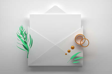 Opened envelope with a blank empty paper card and decorative gold engagement rings and plant branch. 3d illustration.の写真素材