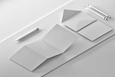 Isometric composition with trifold leaflet, opened envelope, message card and pencils on white background. 3d illustration.の写真素材