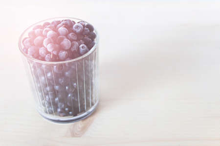 Close up of glass full of blueberries great source of antioxidants. Photo with color tint and copy blank space.の写真素材