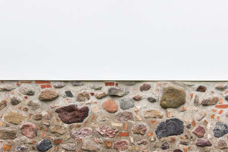 Combination of two horizontal textured - white plaster and rough brick stane wall. Photo with copy blank space.の写真素材