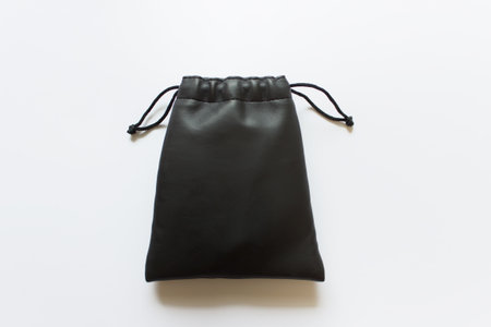 Template of black fabric bag with drawstring on white background.の写真素材