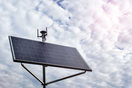 Solar panel station energy generating panel on the background of cloudy sky on rainy day.の写真素材