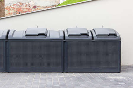 Modern trash garbage collecting containers in European city.の写真素材