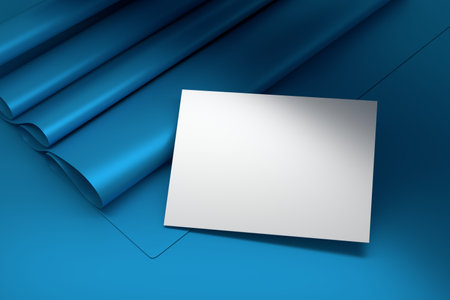 Mockup template with single business card on blue background with folded paper sheet. 3d render.の写真素材