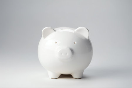 A minimalistic porcelain piggy, sculpted in a simple design, radiates purity as it sits on a crisp white background, Generative AIの素材
