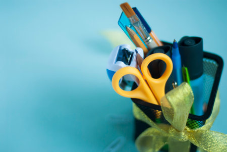 School supplies in an organizer for pencils and pens. Back to school. Place for your text. Stationery.の写真素材