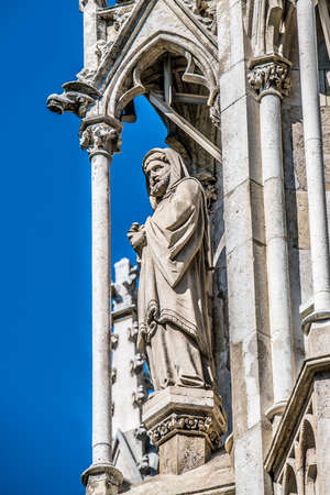 Statue on the facade of the Votive Church. Vienna Austriaの写真素材