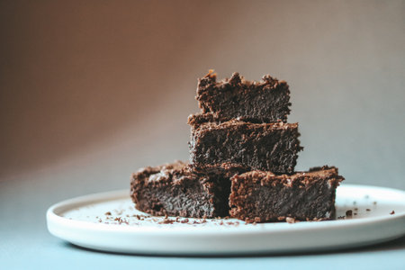 Chocolate brownies on a white plate. Selective focus.