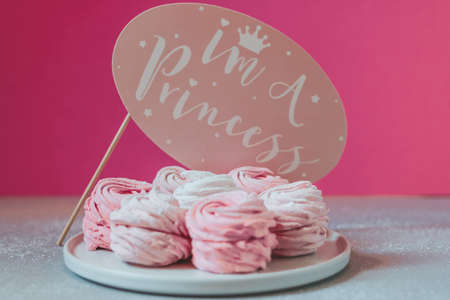 Home made zephyr on pink background with pink paper speech bubble with text im a princessの写真素材