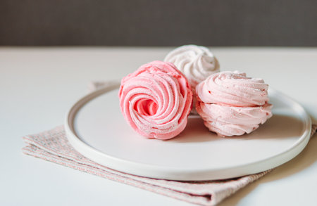 Home made zephyr sweets on a Scandinavian style plateの写真素材