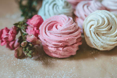 Close up on zephyr sweets and a beautiful flowerの写真素材