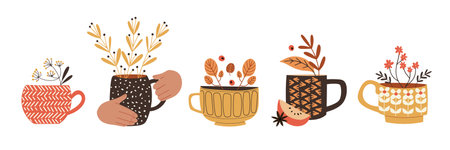 Cute set with cups and mugs, decorated with seasonal plants and branches. Herbal tea or mulled wine. Isolated vector illustration in flat designのイラスト素材