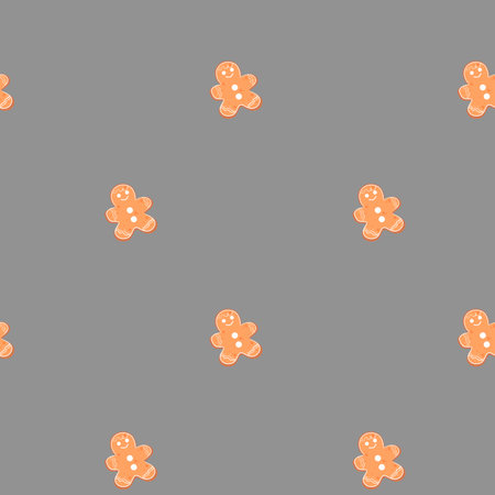 Gingerbread cookies scattered on a smooth gray background for festive decorationの写真素材
