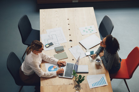Two women freelancer working together in modern coworking. Teamwork conceptの写真素材