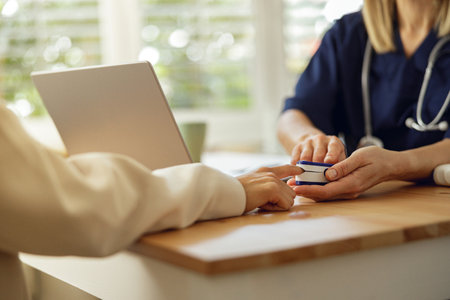Doctor therapist conducts a preventive examination of patient in her office in a modern clinic