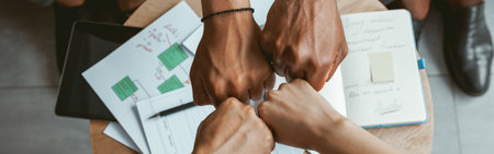 Top view of group multi ethnic coworkers stacked hands together as concept of corporate unityの写真素材