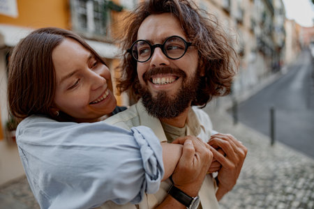Smiling Tourist couple in love cuddling on old Lisbon street. Travel And tourism In Europe conceptの写真素材