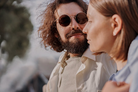 Man in love looking on his girlfriend with smile during romantic date