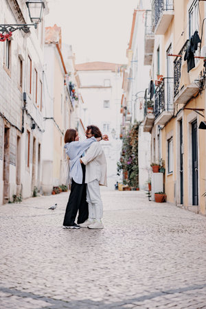Romantic Tourist couple in love cuddling on old Lisbon street. Travel And tourism In Europe conceptの写真素材