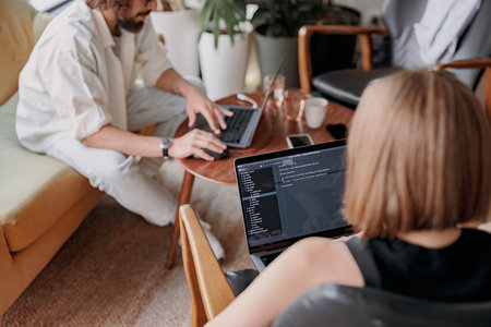 Close up of couple of freelancers working together in modern coworking space. Distance work conceptの写真素材