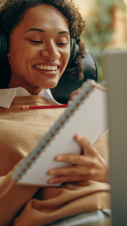 A Joyful and Young Woman Thoroughly Engaged in the Art of Creative Writing Today